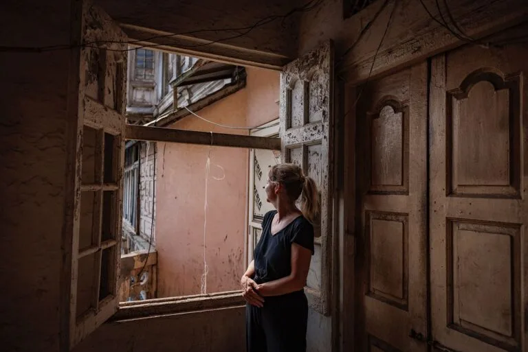 a-beautiful-girl-looking-out-ofthe-window-inspice-market-in-old-delhi-chandni-chowk WhatsApp Image 2024 07 29 at 6.22.32 PM 2