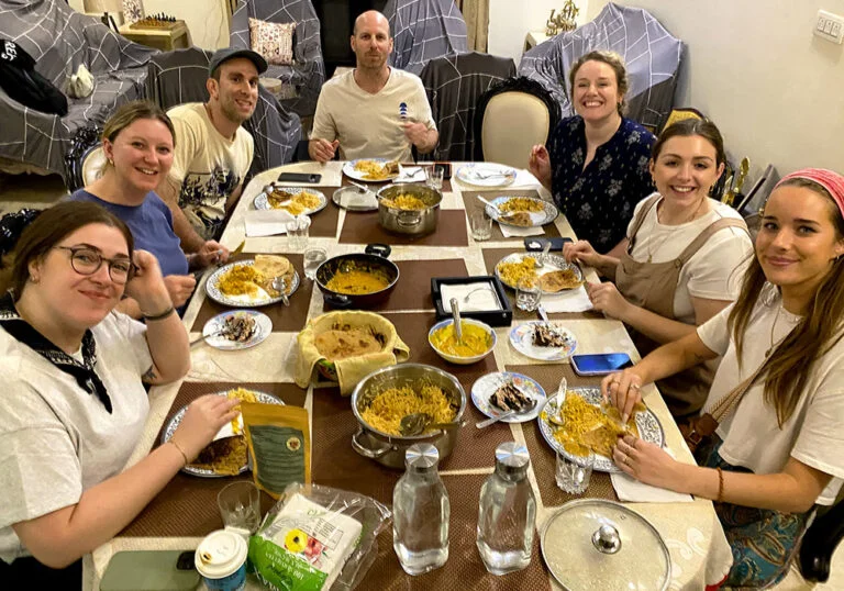 foreign-guest-having-Indian-dinner-indian-local-home 17