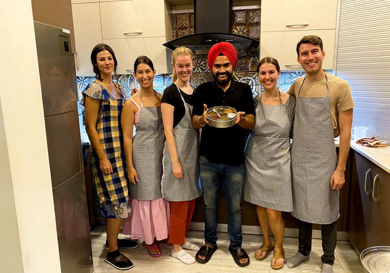 Jd with guest on art of indian cooking class Indian cooking class in an indian kitchen