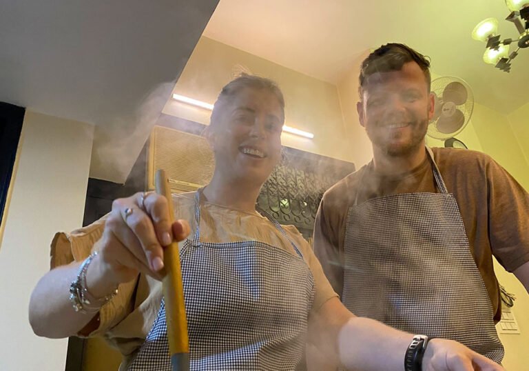 Happy brother and sisiter enjoy learning indian dishes