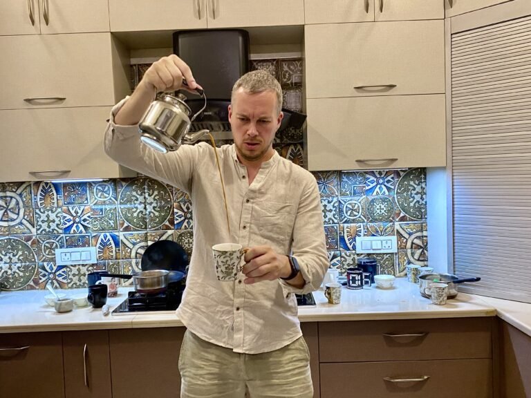 Guest pouring Masala Chai in Cup  Guest pouring Chai in Cup