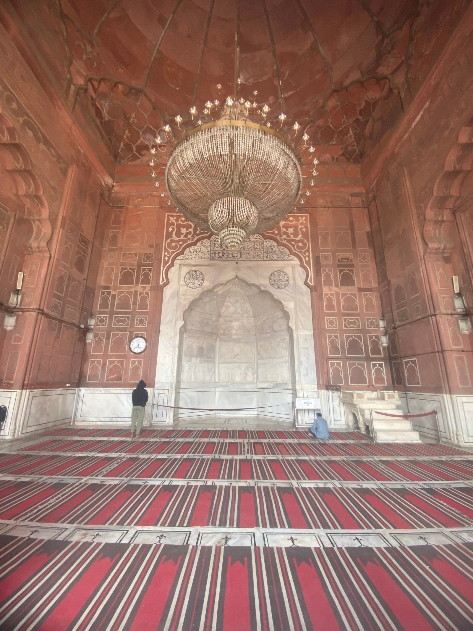 Interior prayer hall view of Jama Masjid with arches and marble flooring