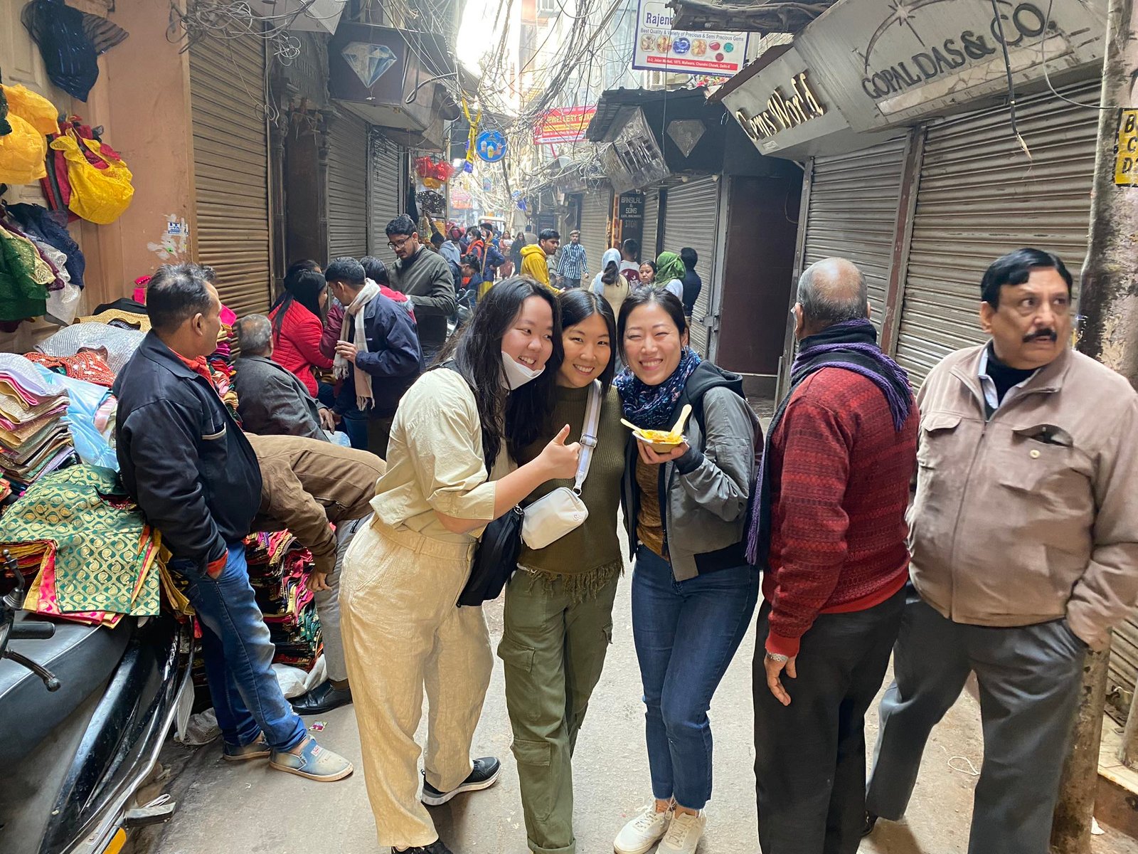 Korean female travelers enjoying a street food tour in Old Delhi India