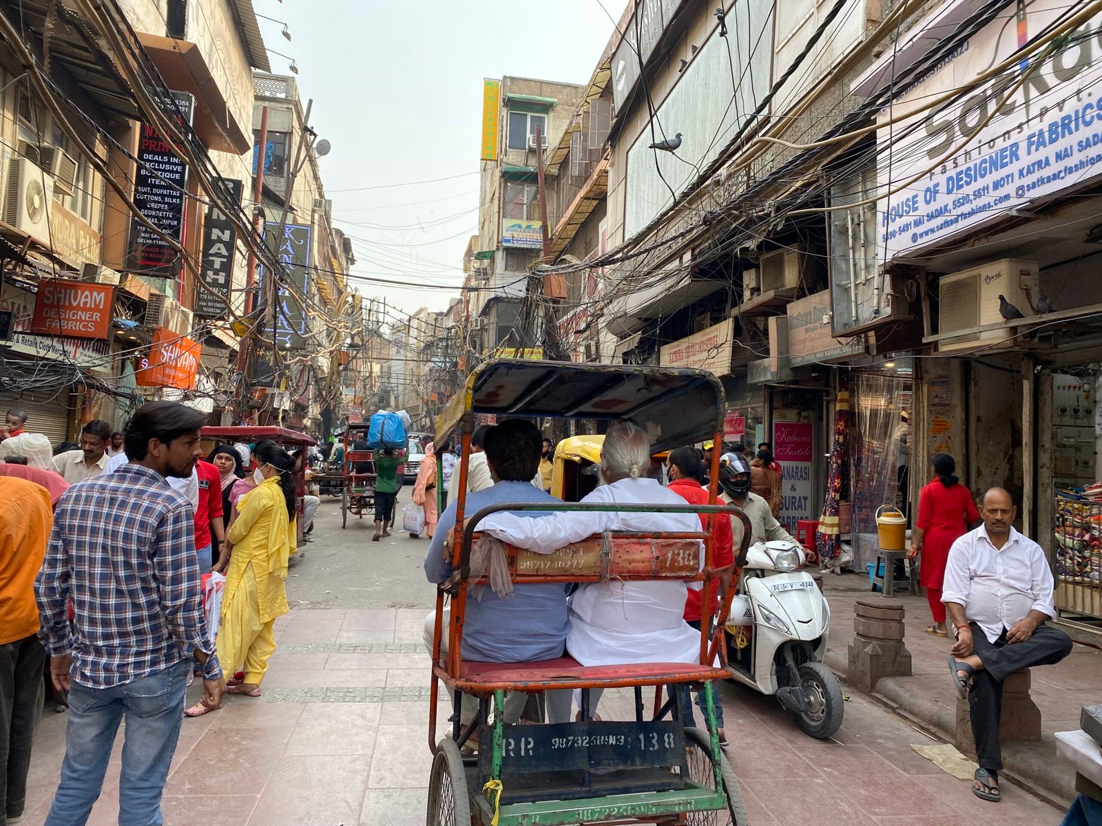 Cycle rickshaws navigating through the streets of Old Delhi near Chandni Chowk