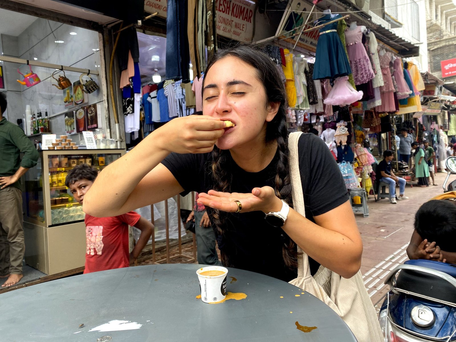 Street food stalls in Old Delhi with fresh pakoras being fried in a large iron pan