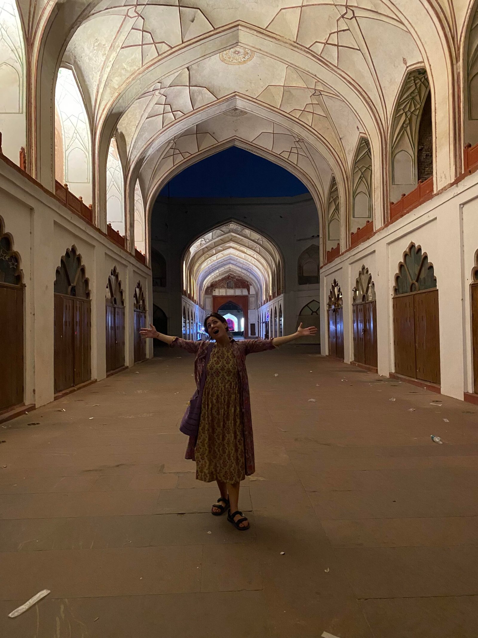 Solo female traveler visiting Red Fort Delhi at night