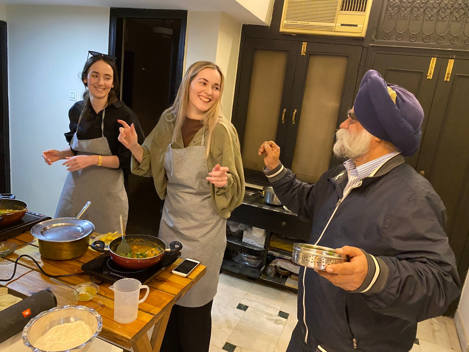 Chai being prepared during a traditional Indian cooking and tea experience in Delhi