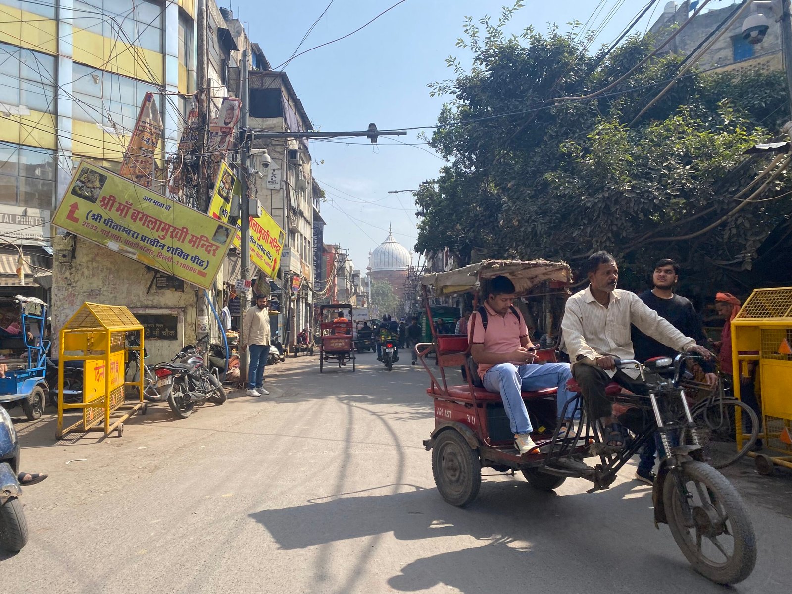 Tourists exploring Chandni Chowk and Old Delhi by cycle rickshaw