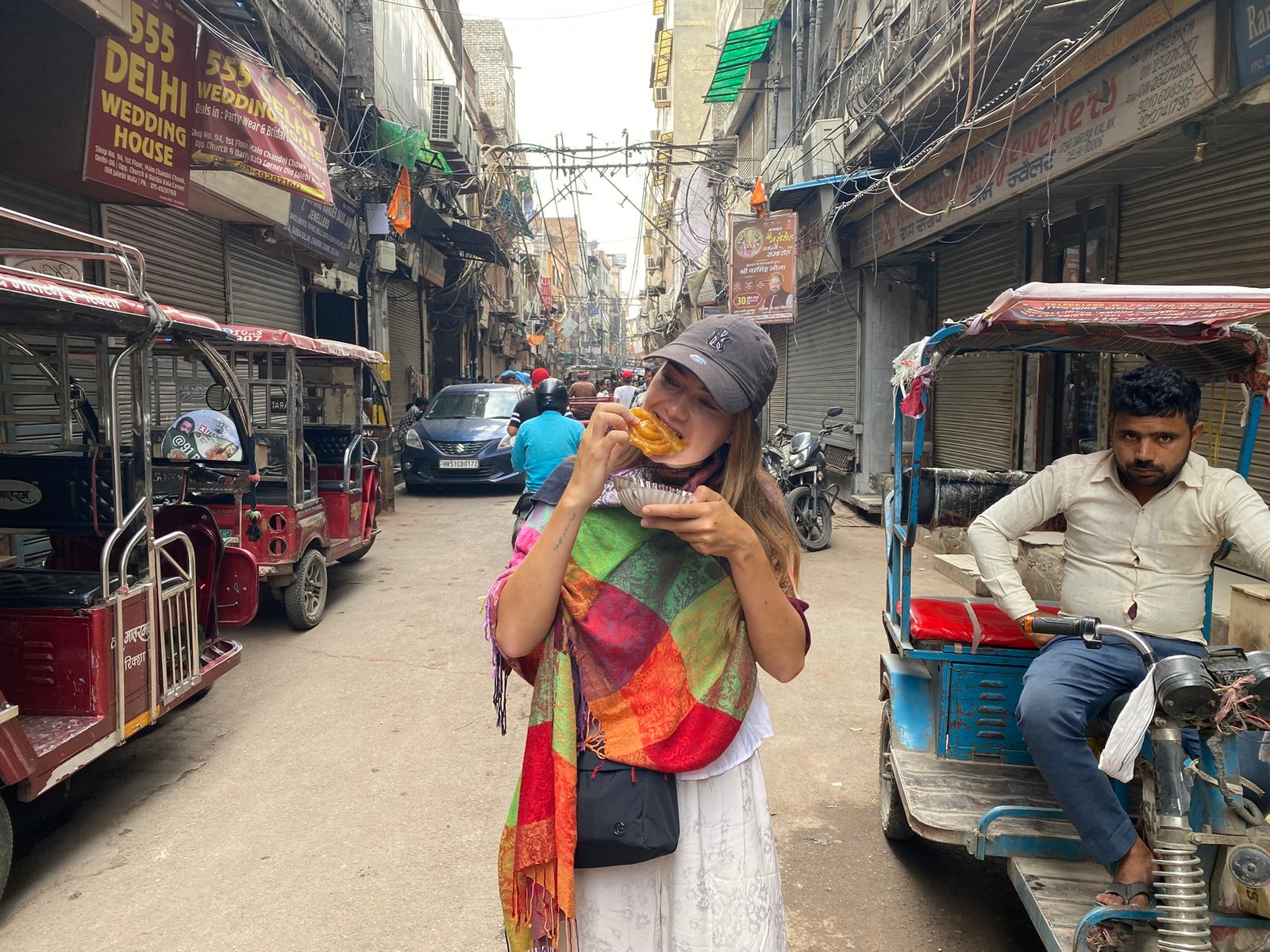 Female tourist walking through the lanes of Old Delhi