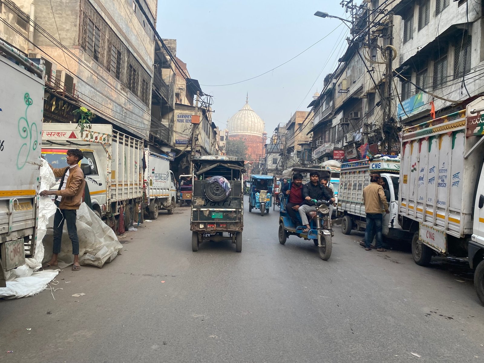 Bustling market lane near Jama Masjid entrance in Old Delhi
