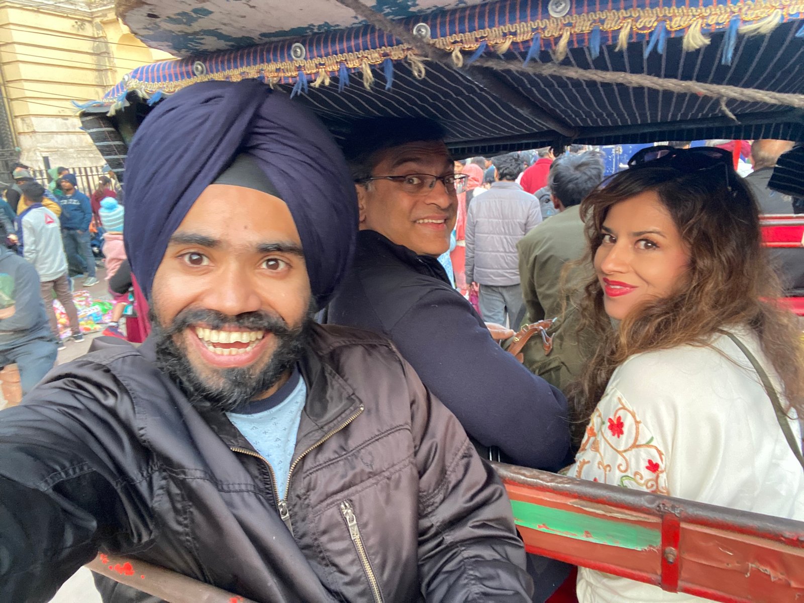 Tour guide with happy guests on an Old Delhi food and cultural tour with Explore Real India