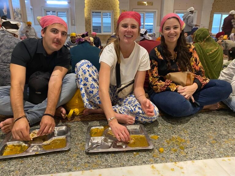 tourists eating in Sikh temple scaled