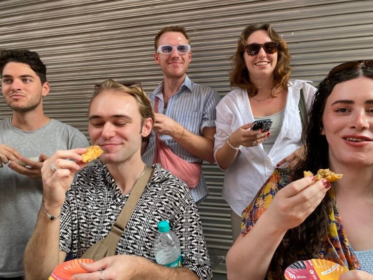 tourists exploring old delhi street food safely scaled
