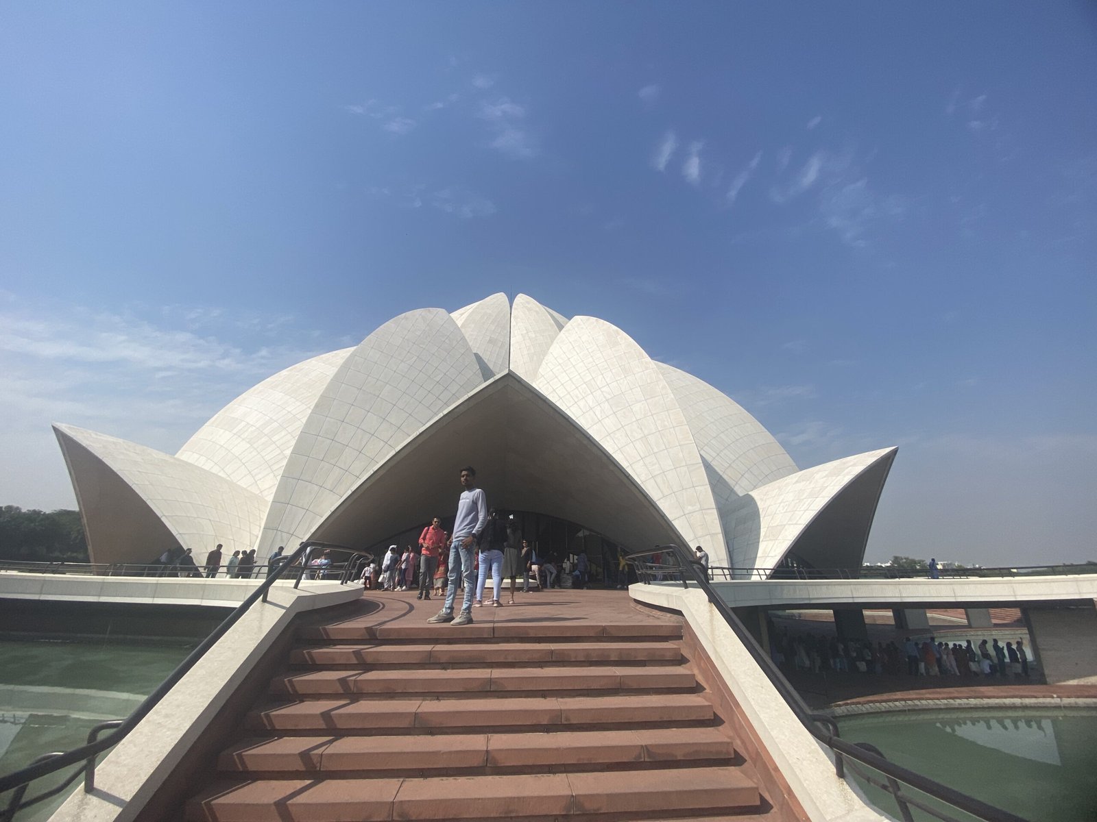 Lotus Temple viewed from the front with garden and pools