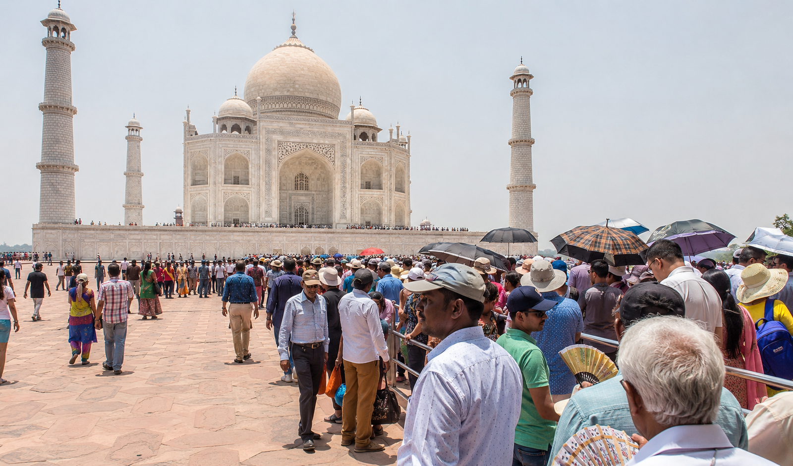 Taj Mahal during peak midday hours with large crowds and harsh sunlight in Agra