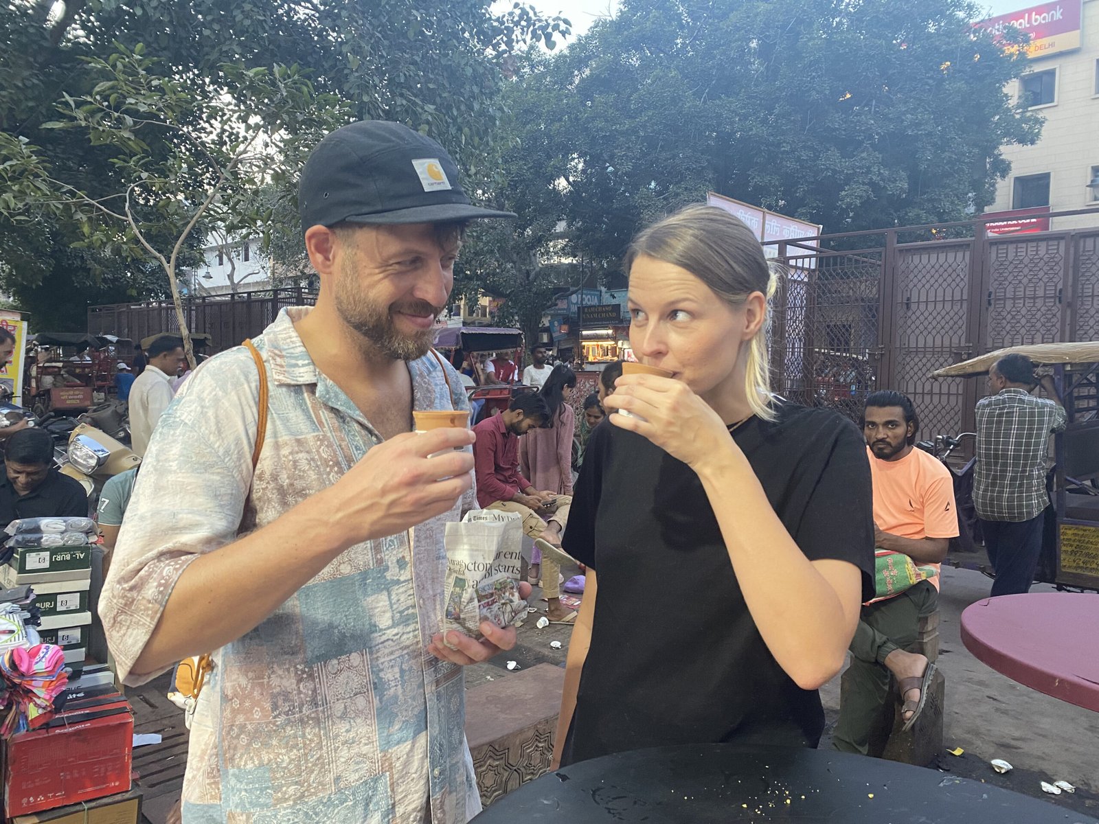 International female traveler from Germany sipping masala chai on a Delhi food tour