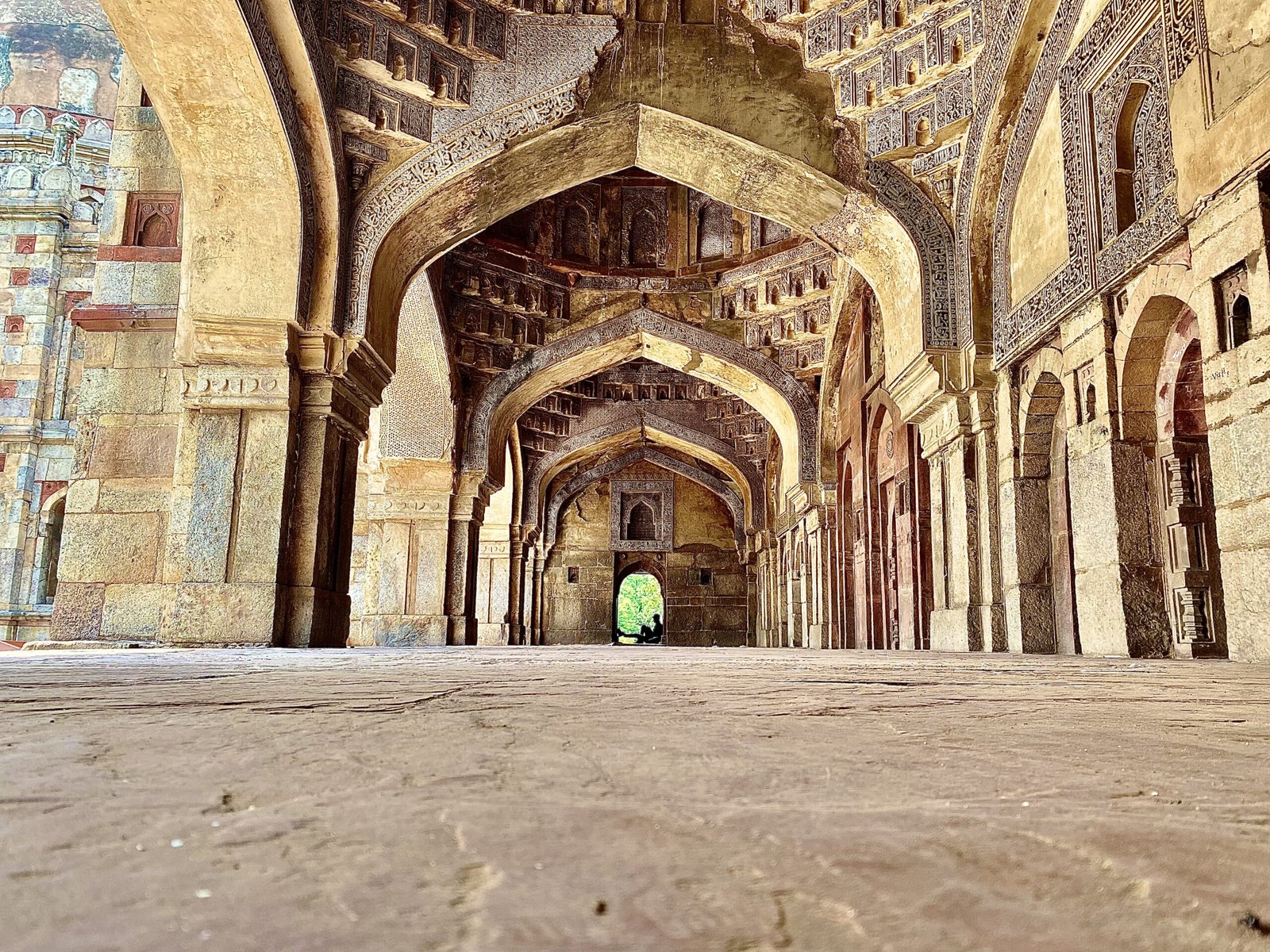 Arched facade of Bara Gumbad mosque in Lodhi Gardens
