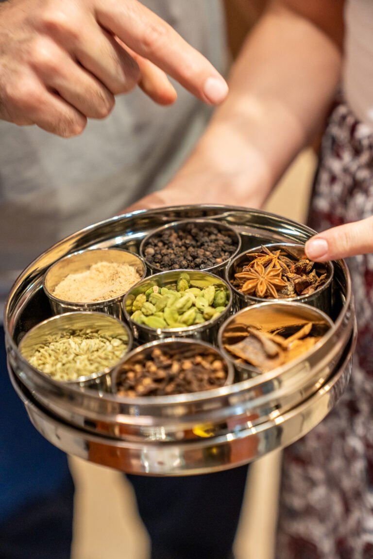 preparing fresh indian chai with spices