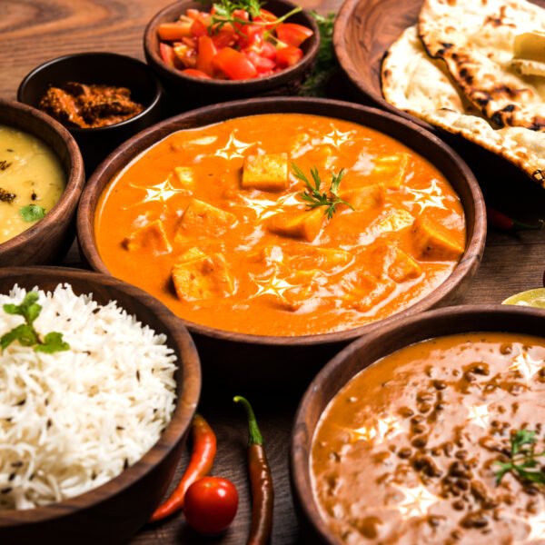 Assorted indian food for lunch or dinner, rice, lentils, paneer, dal makhani, naan, chutney, spices