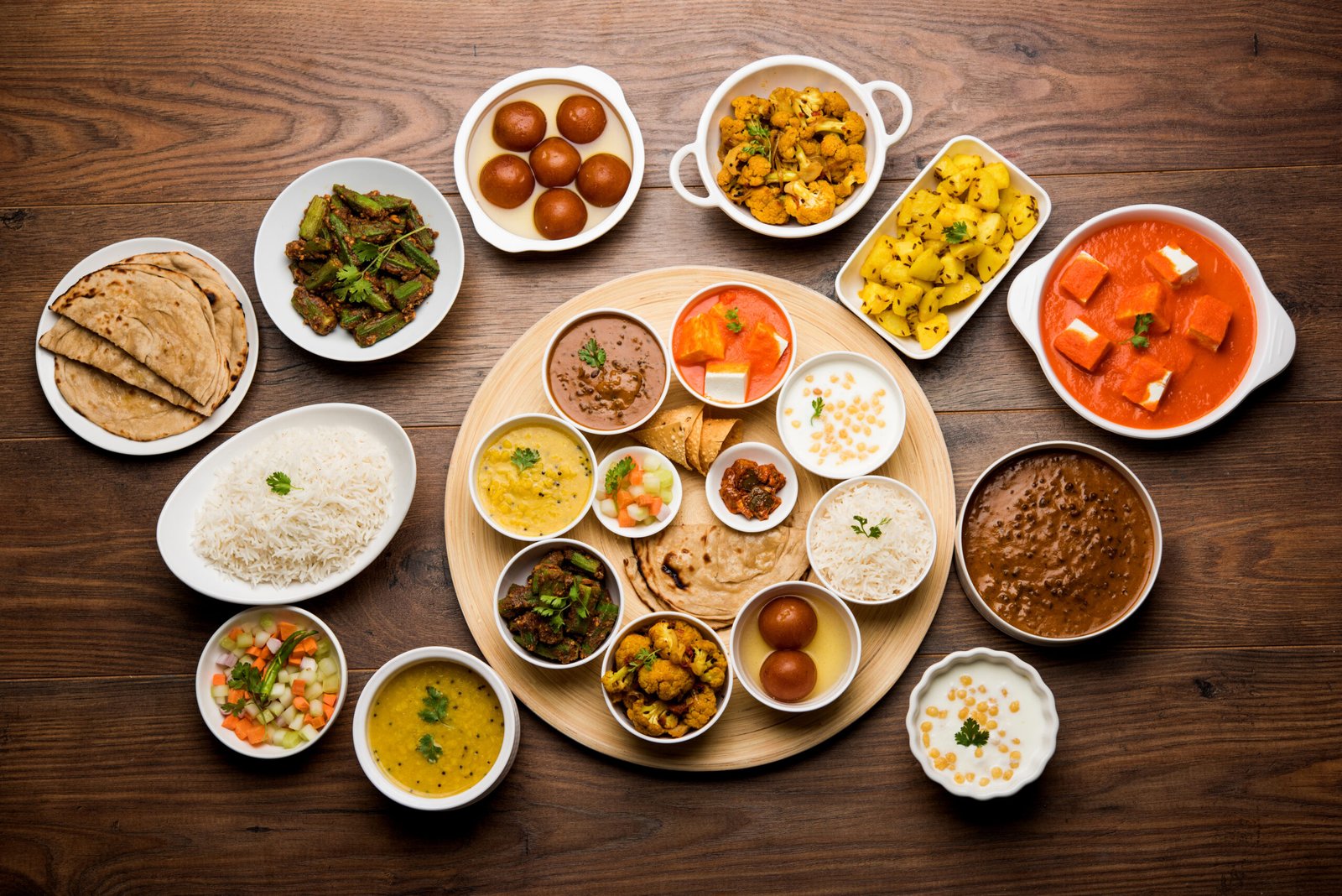 North Indian vegetarian thali with roti, dal and sabzi on a steel plate