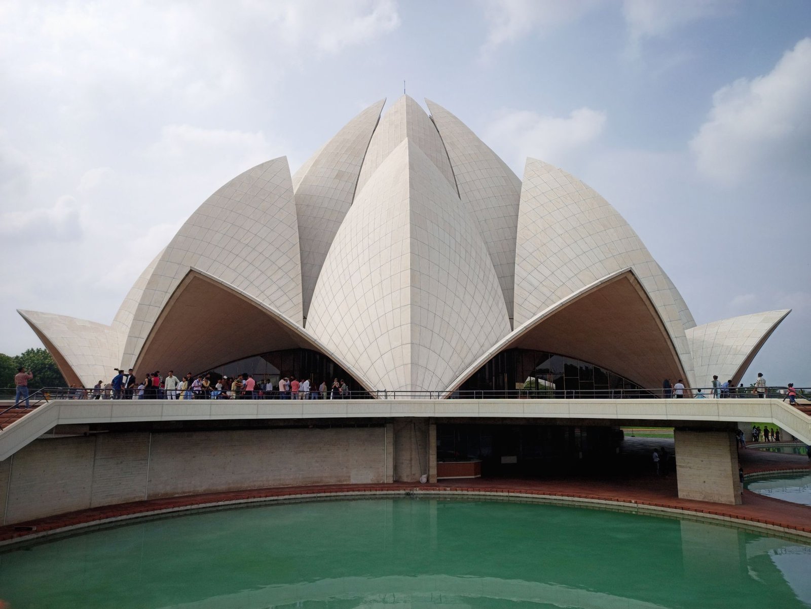 Lotus Temple surrounded by reflecting pools and gardens