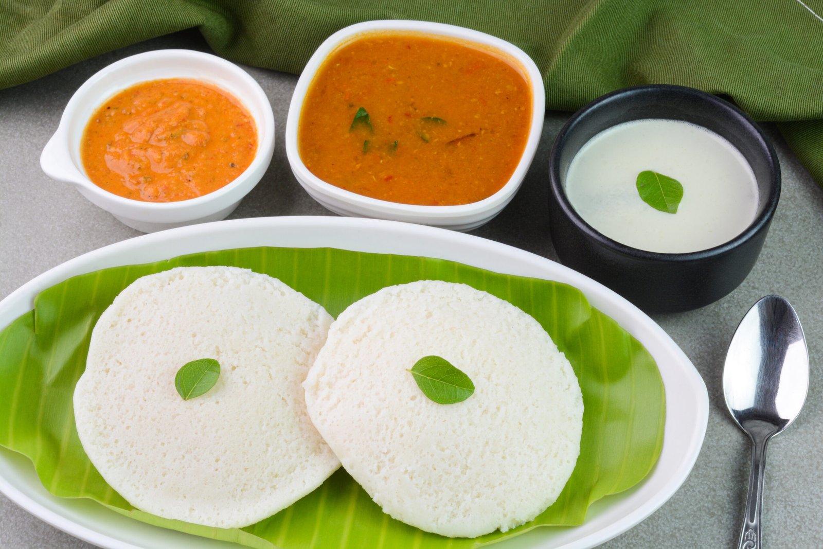South Indian idli served with sambar and coconut chutney
